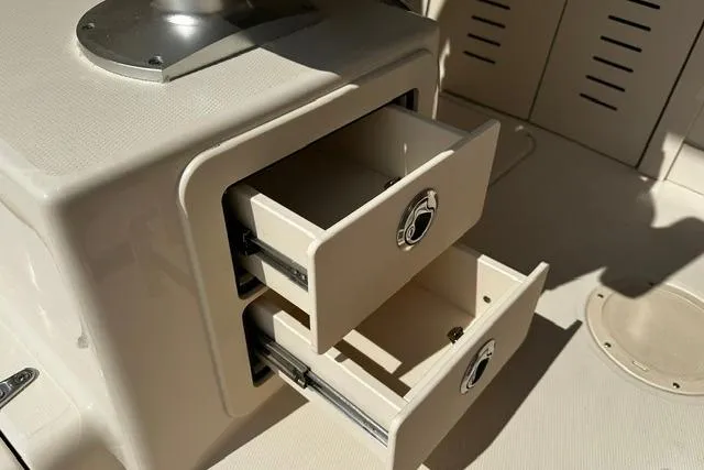 Slide: The Image of Open storage drawers on a 2025 Grady-White Gulfstream 232 boat interior. - 34