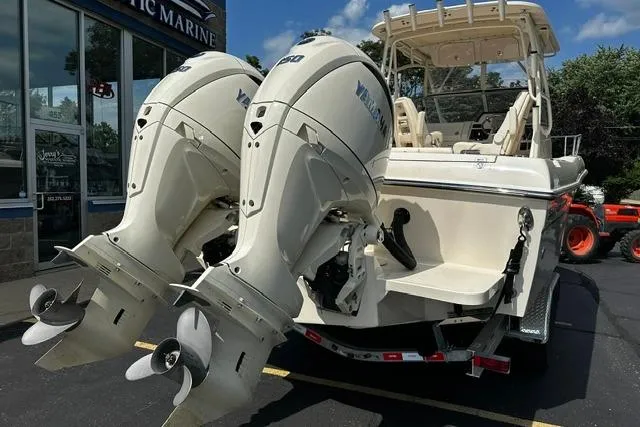 Slide: The Image of 2025 Grady-White Gulfstream 232 boat with dual Yamaha outboard engines, parked at a marina. - 8