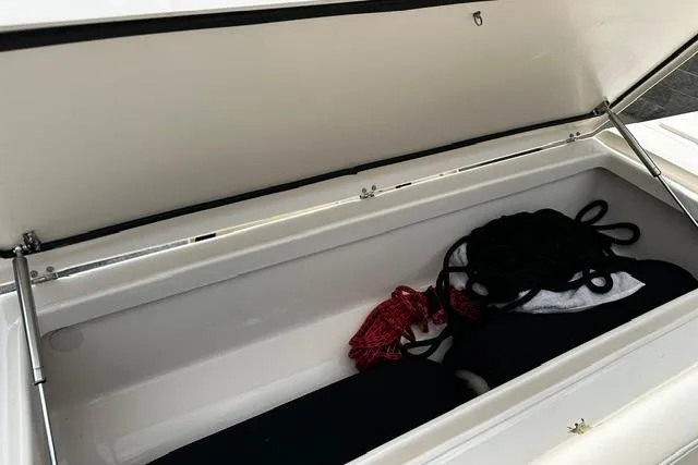 Slide: The Image of Open storage compartment in 2025 Grady-White Gulfstream 232 boat with ropes inside. - 20