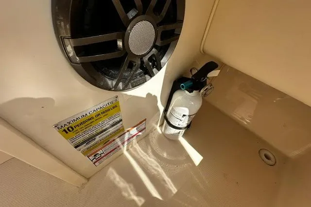 Slide: The Image of Fire extinguisher and speaker on 2025 Grady-White Gulfstream 232 boat interior. - 32