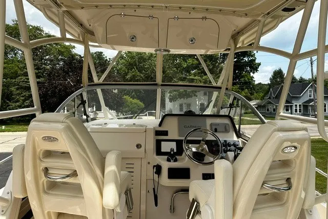 Slide: The Image of Interior view of 2025 Grady-White Gulfstream 232 boat cockpit with steering wheel and controls. - 26