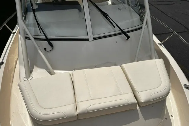 Slide: The Image of 2025 Grady-White Gulfstream 232 boat with cushioned seating and windshield wipers. - 49