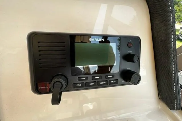 Slide: The Image of Garmin marine radio on 2025 Grady-White Gulfstream 232 boat dashboard. - 29