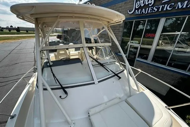 Slide: The Image of 2025 Grady-White Gulfstream 232 boat at dealership, showcasing sleek design and sturdy construction. - 45