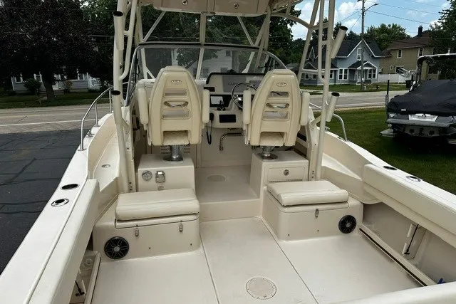 Slide: The Image of 2025 Grady-White Gulfstream 232 boat interior with dual seats and spacious deck. - 13