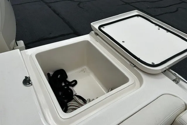 Slide: The Image of Open storage compartment on 2025 Grady-White Gulfstream 232 boat, featuring ropes inside. - 17