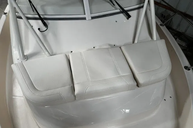 Slide: The Image of 2025 Grady-White Gulfstream 232 boat with white cushioned seating and windshield. - 44