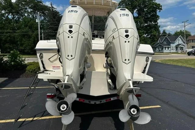 Slide: The Image of 2025 Grady-White Gulfstream 232 boat with dual 150 horsepower outboard engines. - 7