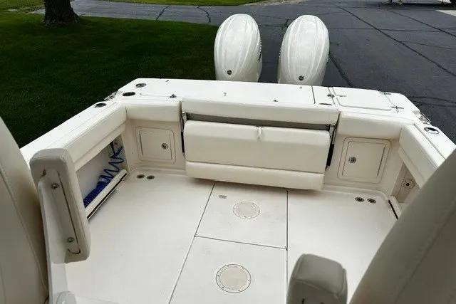 Slide: The Image of 2025 Grady-White Gulfstream 232 boat deck with dual outboard motors, featuring spacious seating. - 51