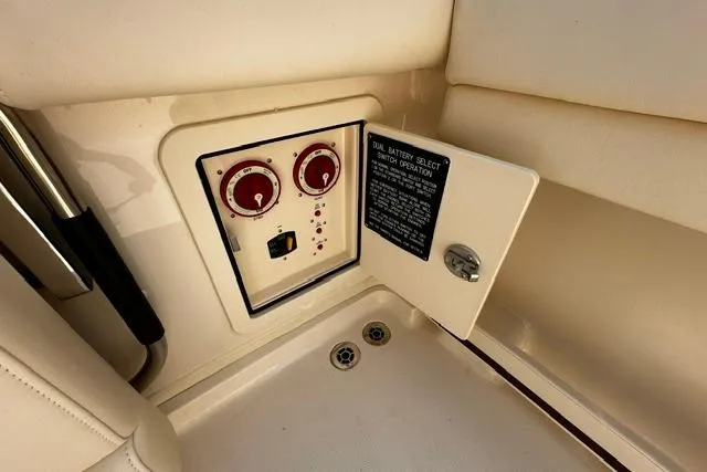 Slide: The Image of 2025 Grady-White Gulfstream 232 boat battery control panel with dual switch operation. - 18