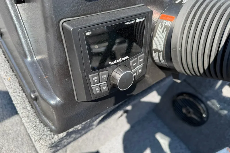Slide: The Image of Control panel of 2027 Lund 1875 Impact XS Sport boat with Rockford Fosgate audio system. - 16