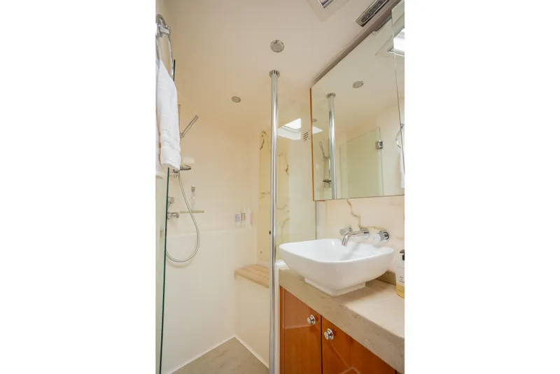 Slide: The Image of Luxurious bathroom in 2012 Riviera 33 Flybridge yacht with modern fixtures and elegant design. - 12