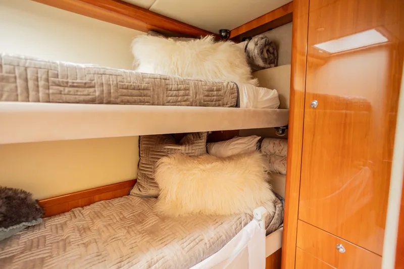 Slide: The Image of Luxurious bunk beds in 2012 Riviera 33 Flybridge yacht cabin. - 17