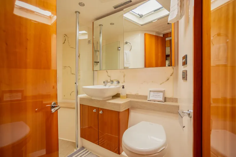 Slide: The Image of Luxurious bathroom interior of 2012 Riviera 33 Flybridge yacht with modern fixtures. - 11
