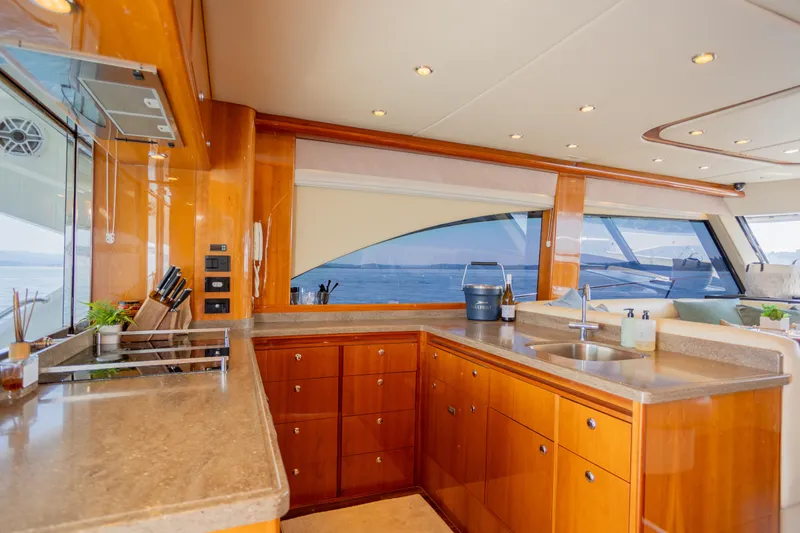 Slide: The Image of Luxurious kitchen interior of 2012 Riviera 33 Flybridge yacht with ocean view. - 4