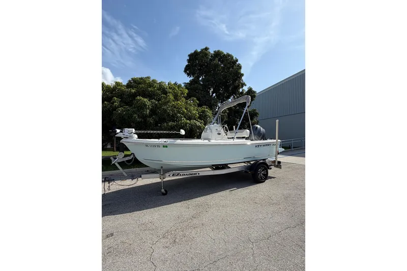 Slide: The Image of 2024 Key West 1720 Center Console boat on trailer, parked outdoors. - 3