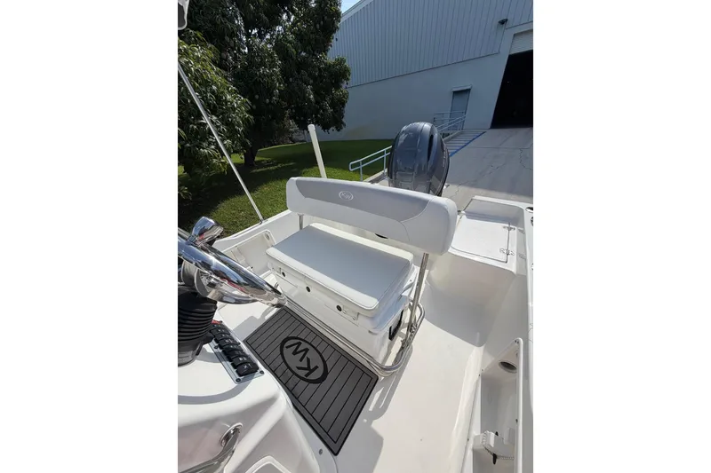 Slide: The Image of 2024 Key West 1720 Center Console boat interior with seating and steering wheel. - 15