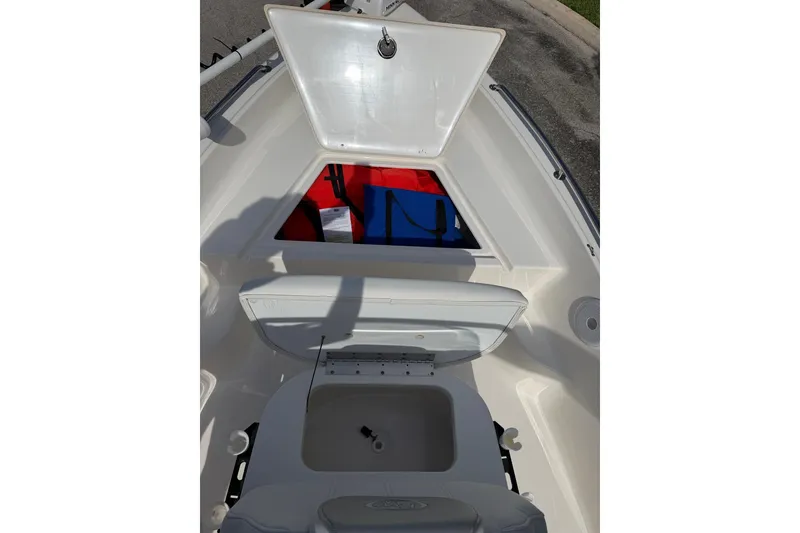Slide: The Image of 2024 Key West 1720 Center Console boat with open storage compartments. - 11