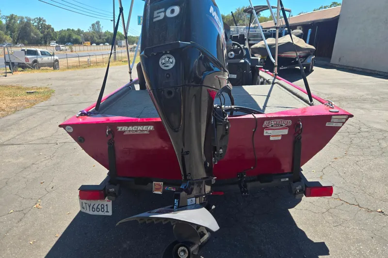 Slide: The Image of 2021 Tracker Bass Tracker Classic XL boat with Mercury 50 engine, parked outdoors. - 53