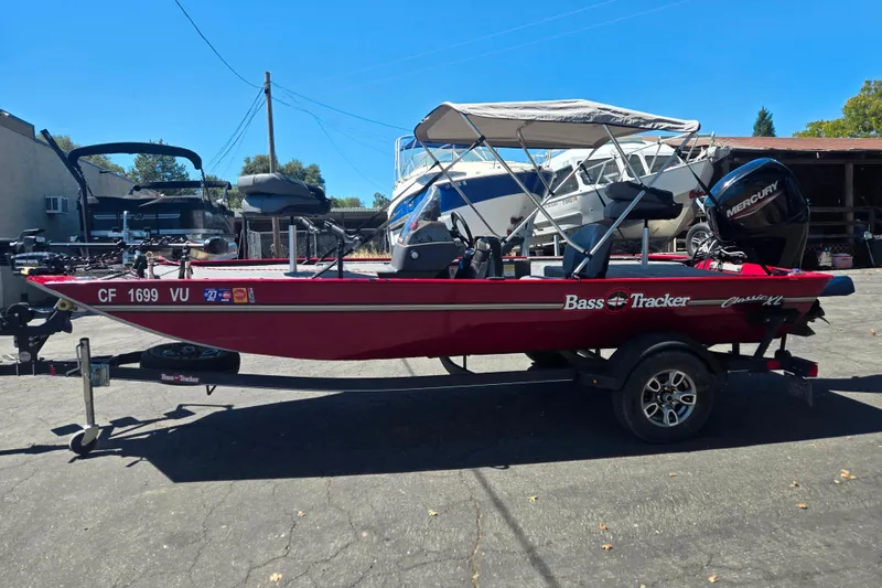 Slide: The Image of 2021 Tracker Bass Tracker Classic XL boat with canopy and Mercury engine. - 57
