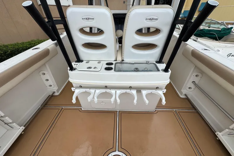 Slide: The Image of 2015 Sailfish 320 CC boat interior with rod holders and seating. - 7