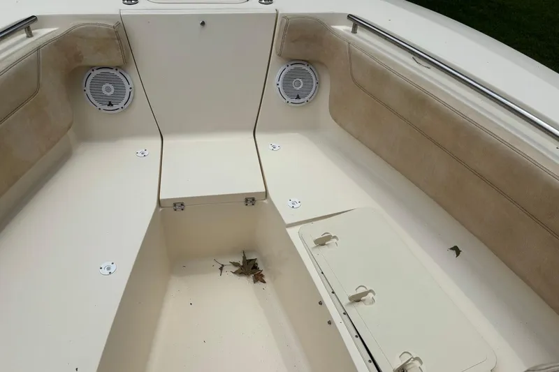 Slide: The Image of Interior of a 2016 Scout 275 Dorado boat, featuring seating and storage compartments. - 20