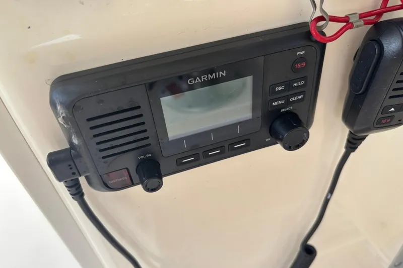 Slide: The Image of Garmin marine radio on 2016 Scout 275 Dorado boat dashboard. - 23