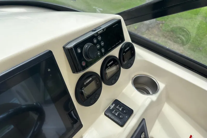 Slide: The Image of Dashboard of a 2016 Scout 275 Dorado boat with Yamaha gauges and Fusion audio system. - 14