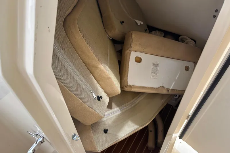 Slide: The Image of Cushions stored inside a 2016 Scout 275 Dorado boat compartment. - 16