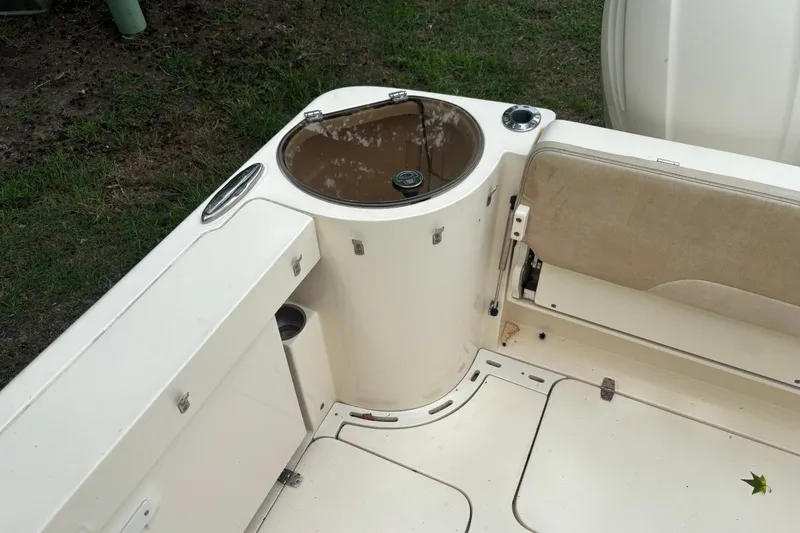 Slide: The Image of Interior view of a 2016 Scout 275 Dorado boat, featuring seating and storage compartments. - 7