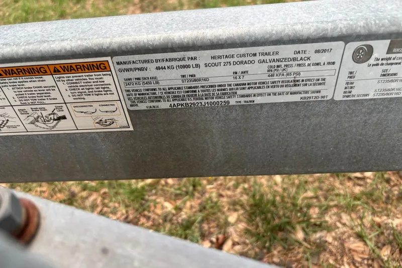 Slide: The Image of Label on a 2016 Scout 275 Dorado trailer, showing specifications and safety warnings. - 2