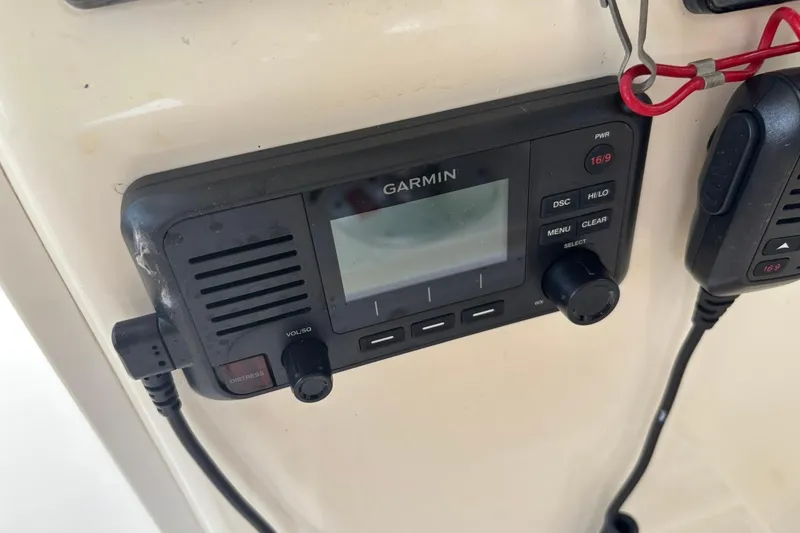 Slide: The Image of Garmin marine radio on 2016 Scout 275 Dorado boat dashboard. - 22