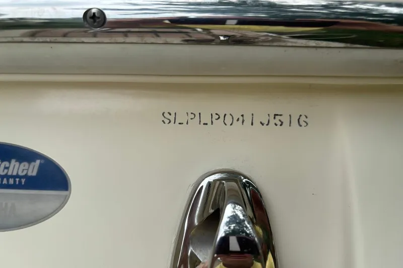 Slide: The Image of 2016 Scout 275 Dorado boat hull identification number and warranty sticker. - 24