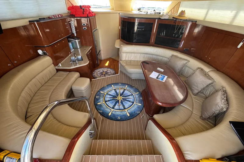 Slide: The Image of Luxurious interior of a 2003 Sea Ray 45 Express Bridge yacht with plush seating and elegant decor. - 9