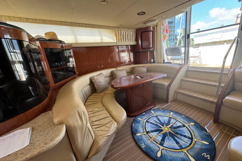 Slide: The Image of Luxurious interior of 2003 Sea Ray 45 Express Bridge yacht with plush seating and nautical decor. - 10