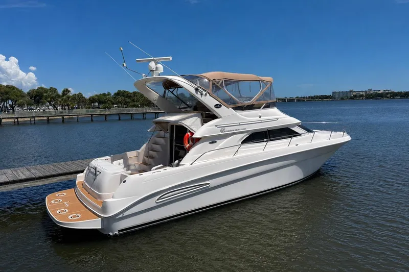The Image of 2003 Sea Ray 45 Express Bridge yacht docked on a sunny day. - 0