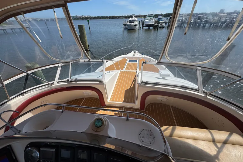Slide: The Image of 2003 Sea Ray 45 Express Bridge yacht interior with scenic marina view. - 6