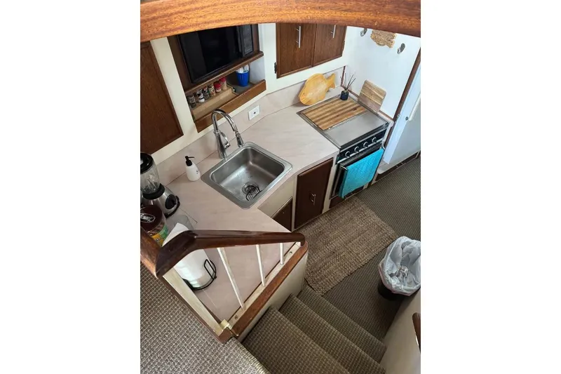 Slide: The Image of Interior view of 1979 Post 42 Convertible yacht kitchen with sink and stove. - 2