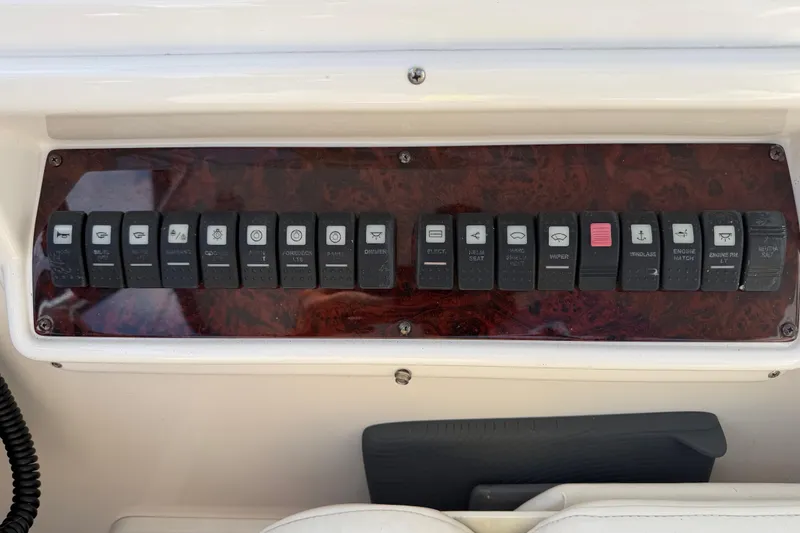 Slide: The Image of Control panel of a 2007 Regal Commodore 3760 IO boat with labeled switches. - 23