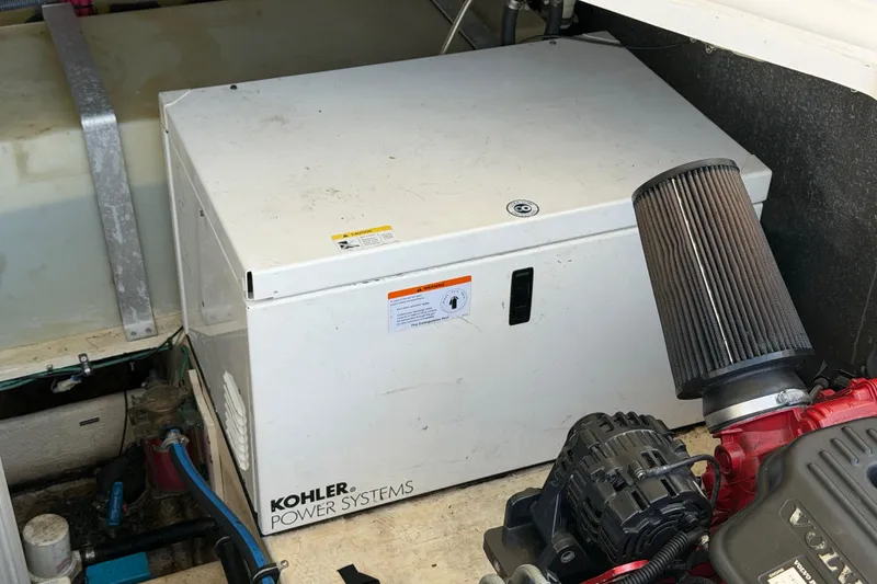 Slide: The Image of Engine compartment of 2007 Regal Commodore 3760 IO with Kohler power system. - 49