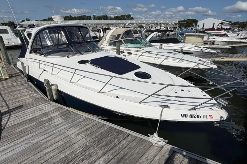 Slide: The Image of 2007 Regal Commodore 3760 IO docked at marina under clear skies. - 5