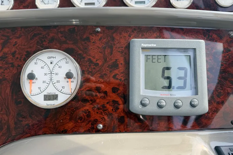 Slide: The Image of Dashboard of 2007 Regal Commodore 3760 IO with depth and fuel gauges. - 22