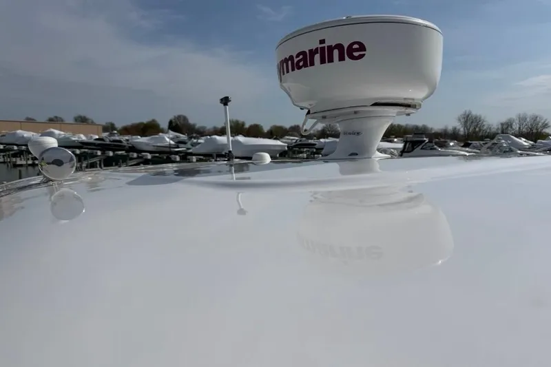 Slide: The Image of 2007 Regal Commodore 3760 IO boat with radar equipment on deck, docked in marina. - 58