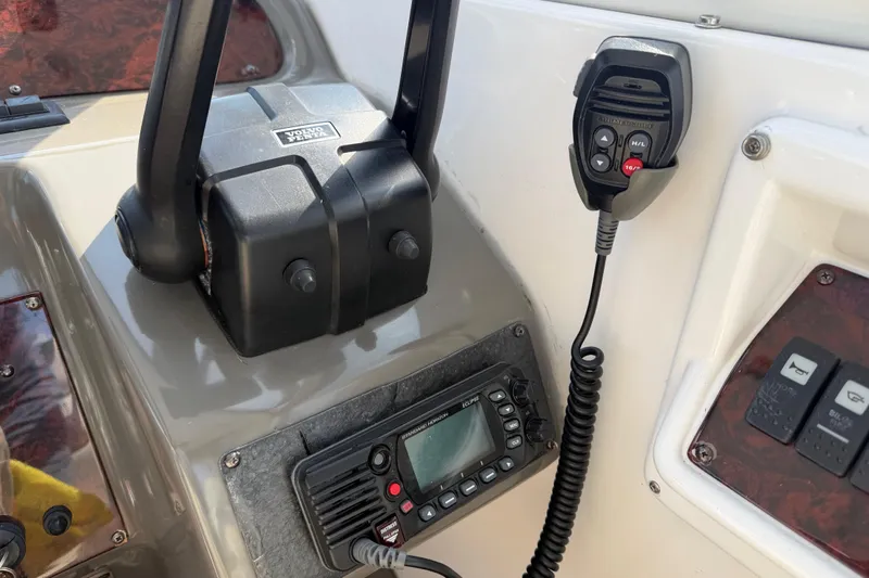 Slide: The Image of Control panel of a 2007 Regal Commodore 3760 IO boat with radio and throttle. - 24