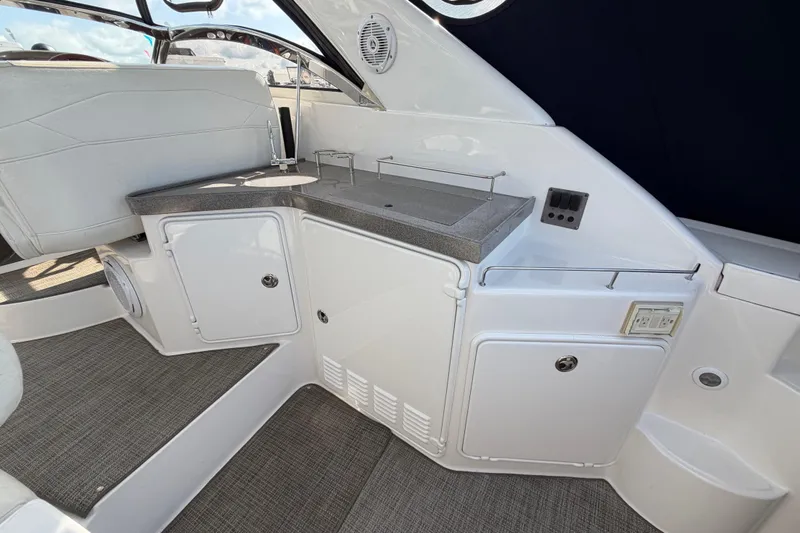Slide: The Image of 2007 Regal Commodore 3760 IO yacht interior with sleek kitchenette and modern design. - 13