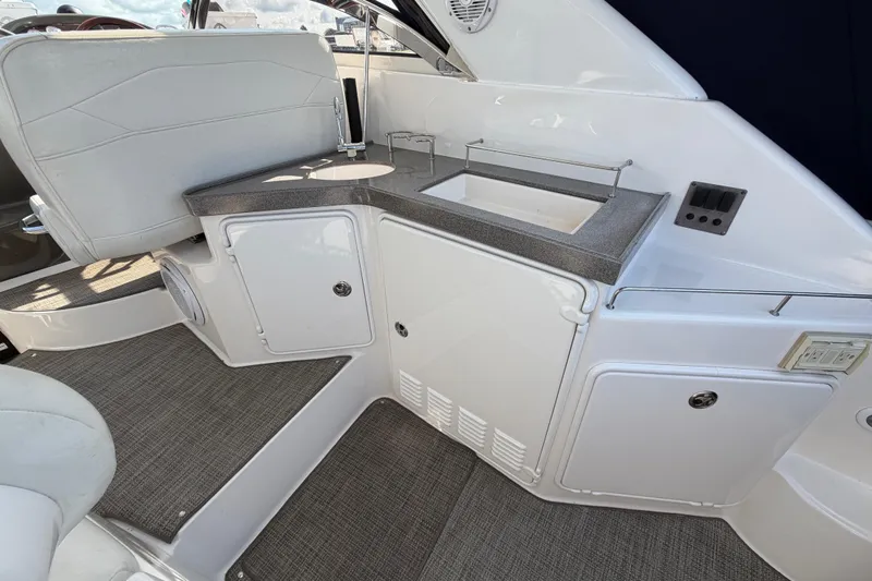 Slide: The Image of 2007 Regal Commodore 3760 IO boat interior with sleek kitchenette and seating area. - 14