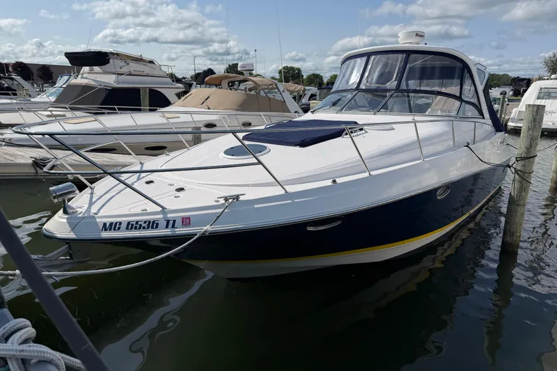 The Image of 2007 Regal Commodore 3760 IO boat docked at marina under cloudy sky. - 0