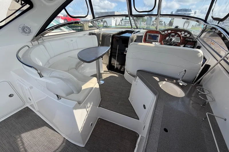 Slide: The Image of 2007 Regal Commodore 3760 IO boat interior with seating, helm, and kitchenette. - 8