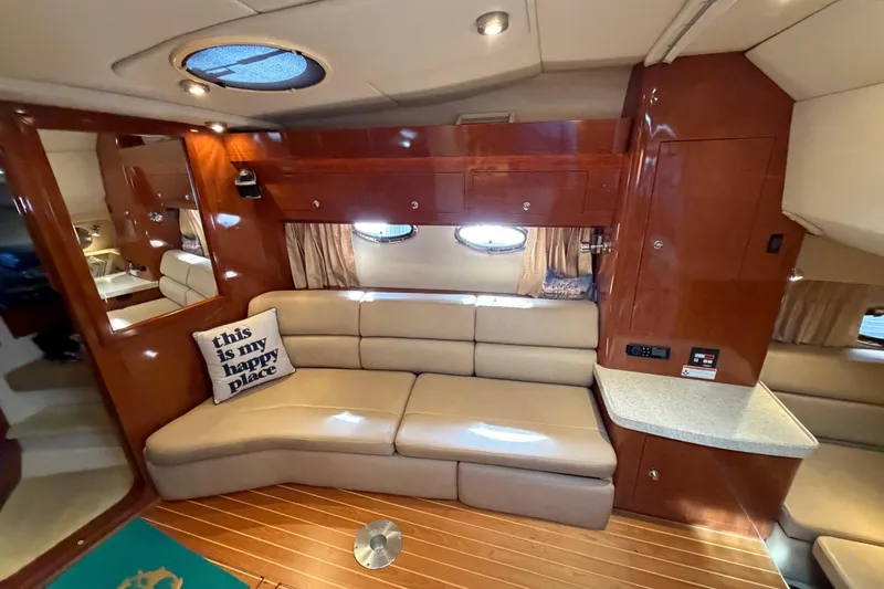 Slide: The Image of Luxurious interior of 2007 Regal Commodore 3760 IO yacht with plush seating and elegant wood finish. - 31