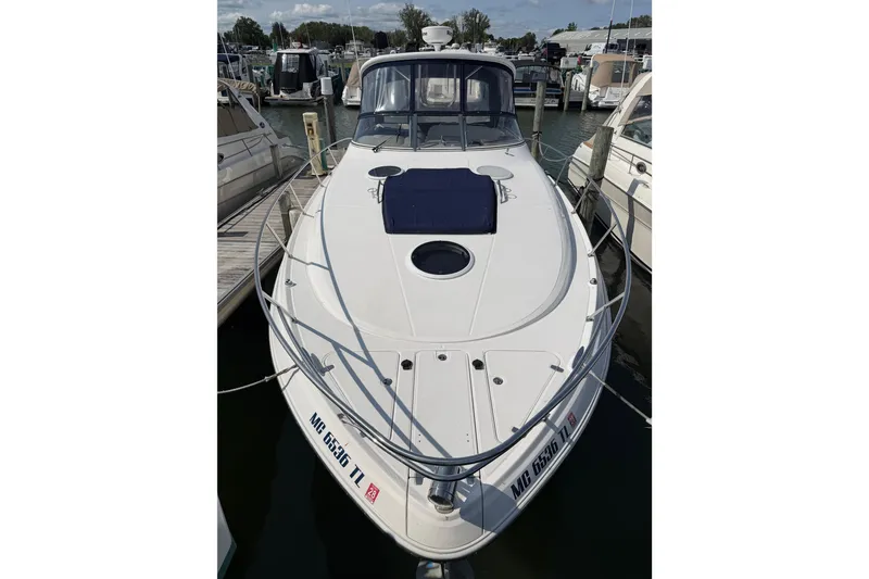 Slide: The Image of 2007 Regal Commodore 3760 IO boat docked at marina, front view. - 6